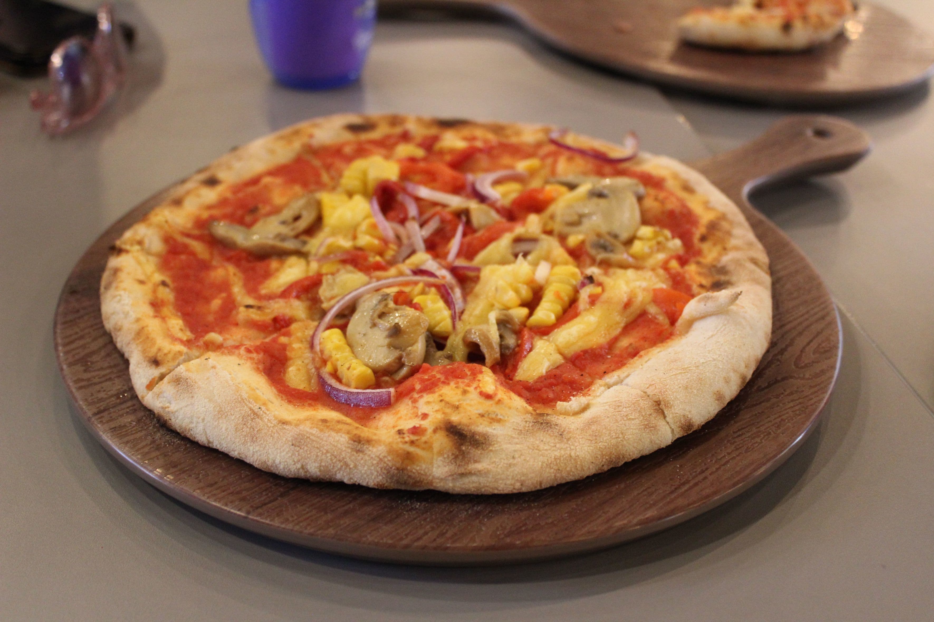 close up of pizza at Injoy