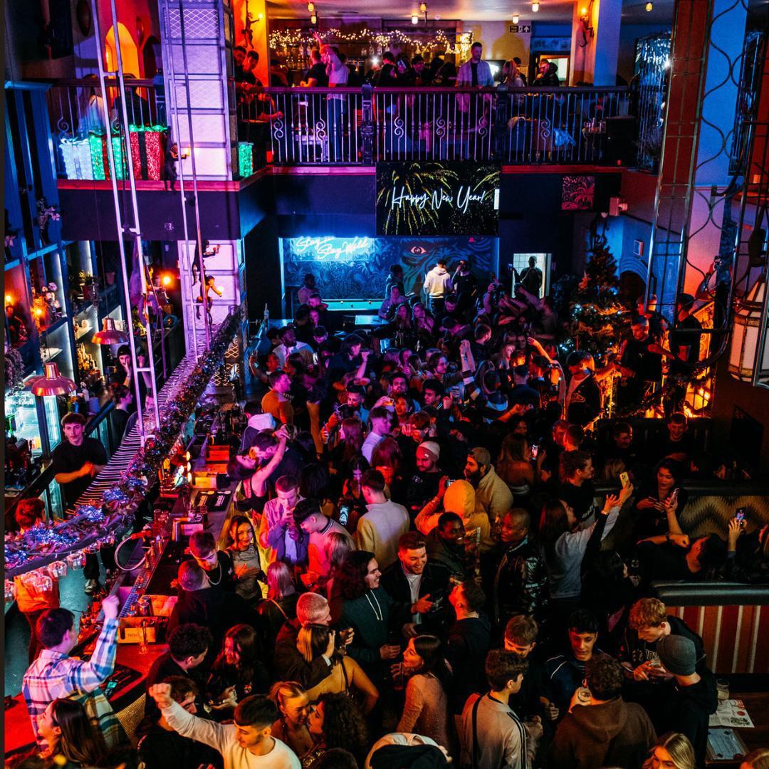 Birds eye view of crowd of revellers inside Grumpy Monkey dancing and drinking