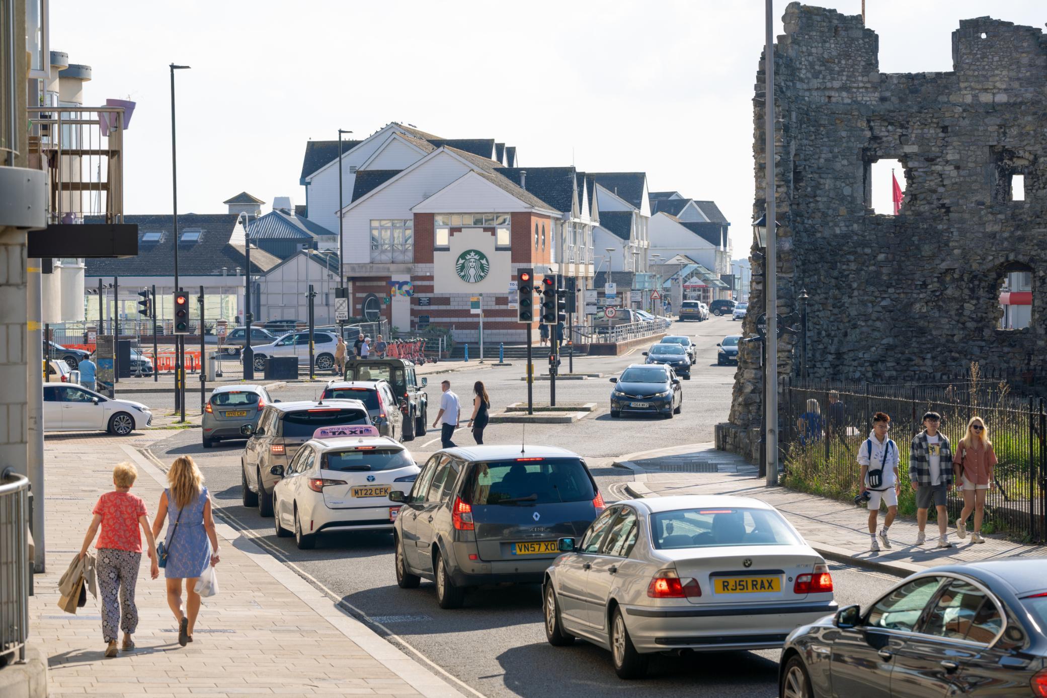 Cars stopped a red traffic light in Town Quay on sunny day