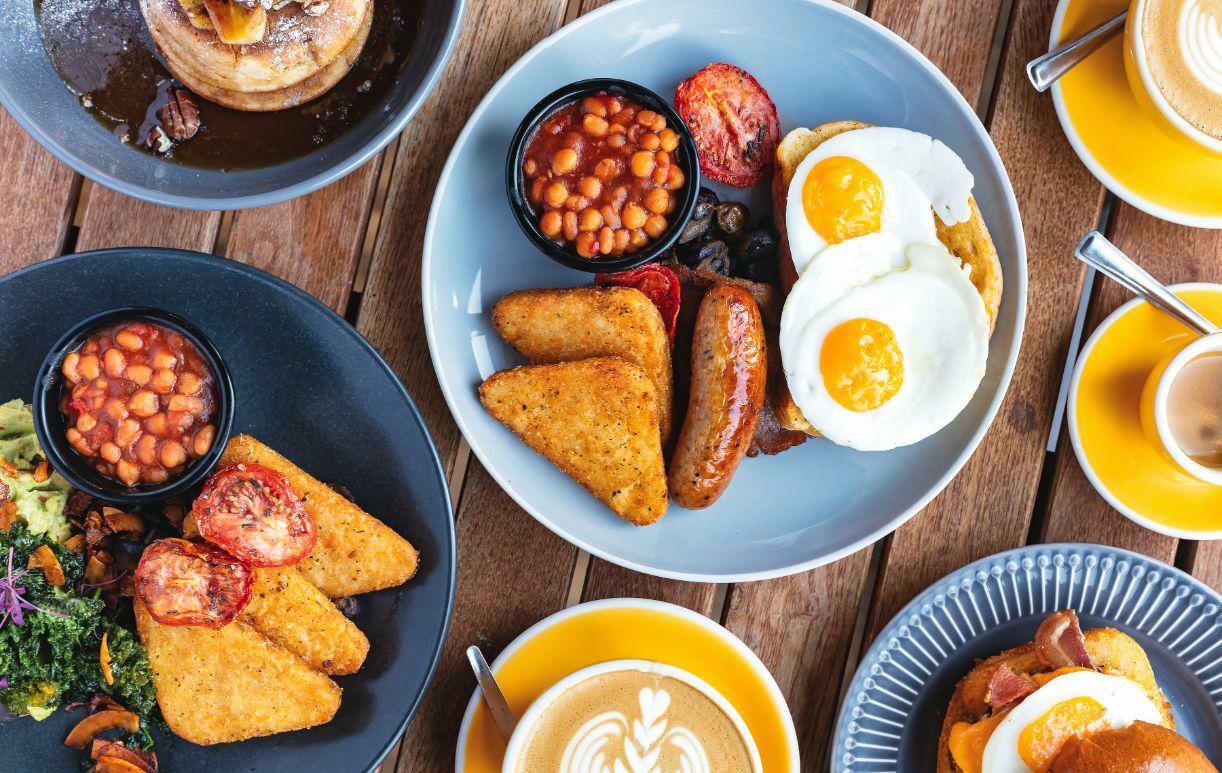 Selection of breakfast dishes and coffees at Mettricks
